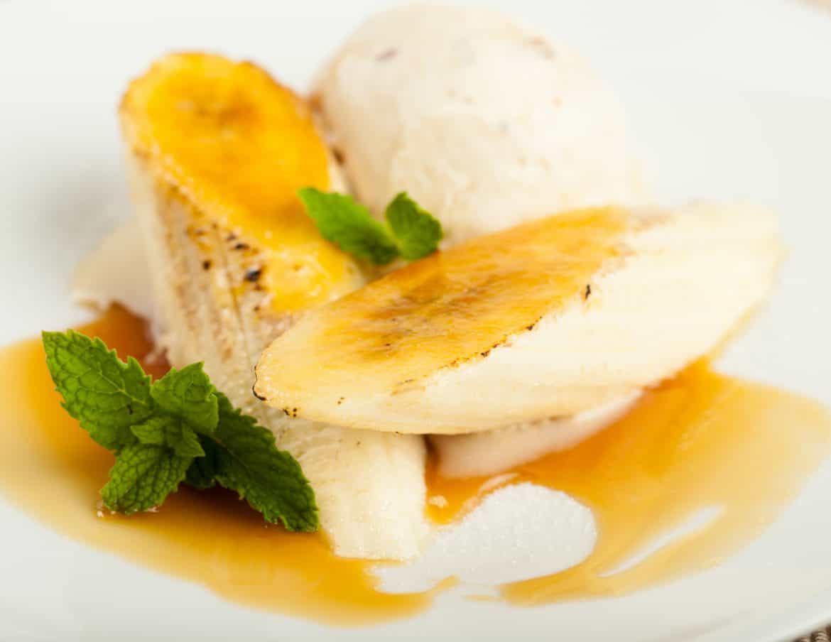 Mouthwatering bananas foster beautifully plated and garnished. Fit for dinner on a superyacht.