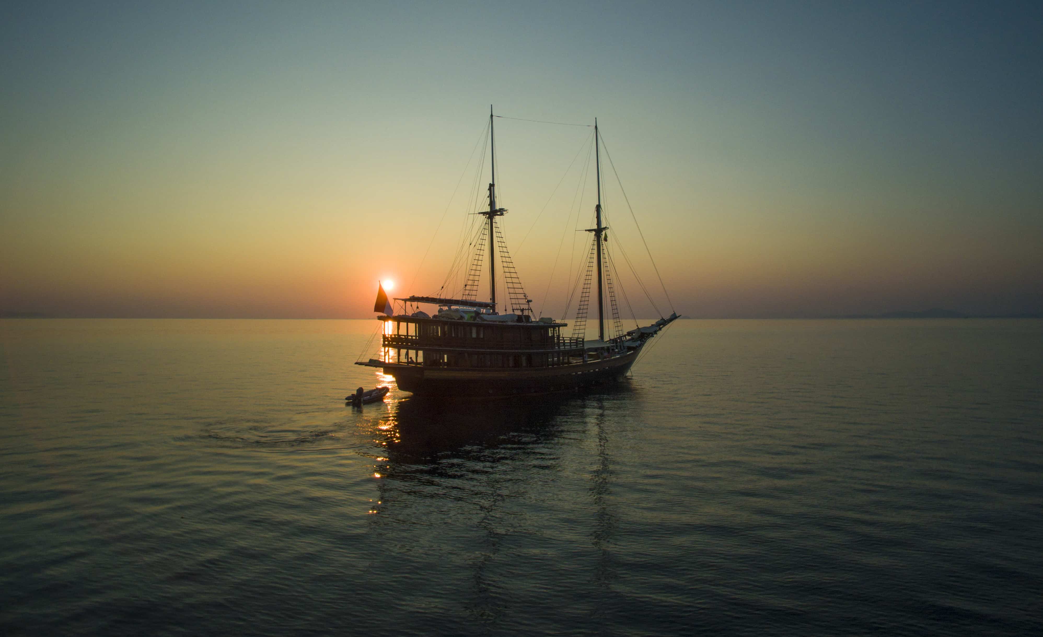 Sailing yacht Dunia Baru at sunset.