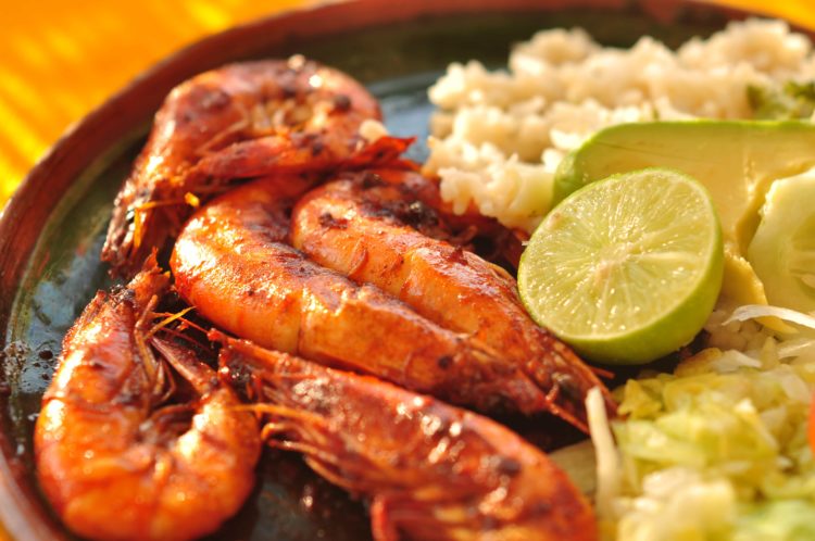 close up of grilled shrimp and rice