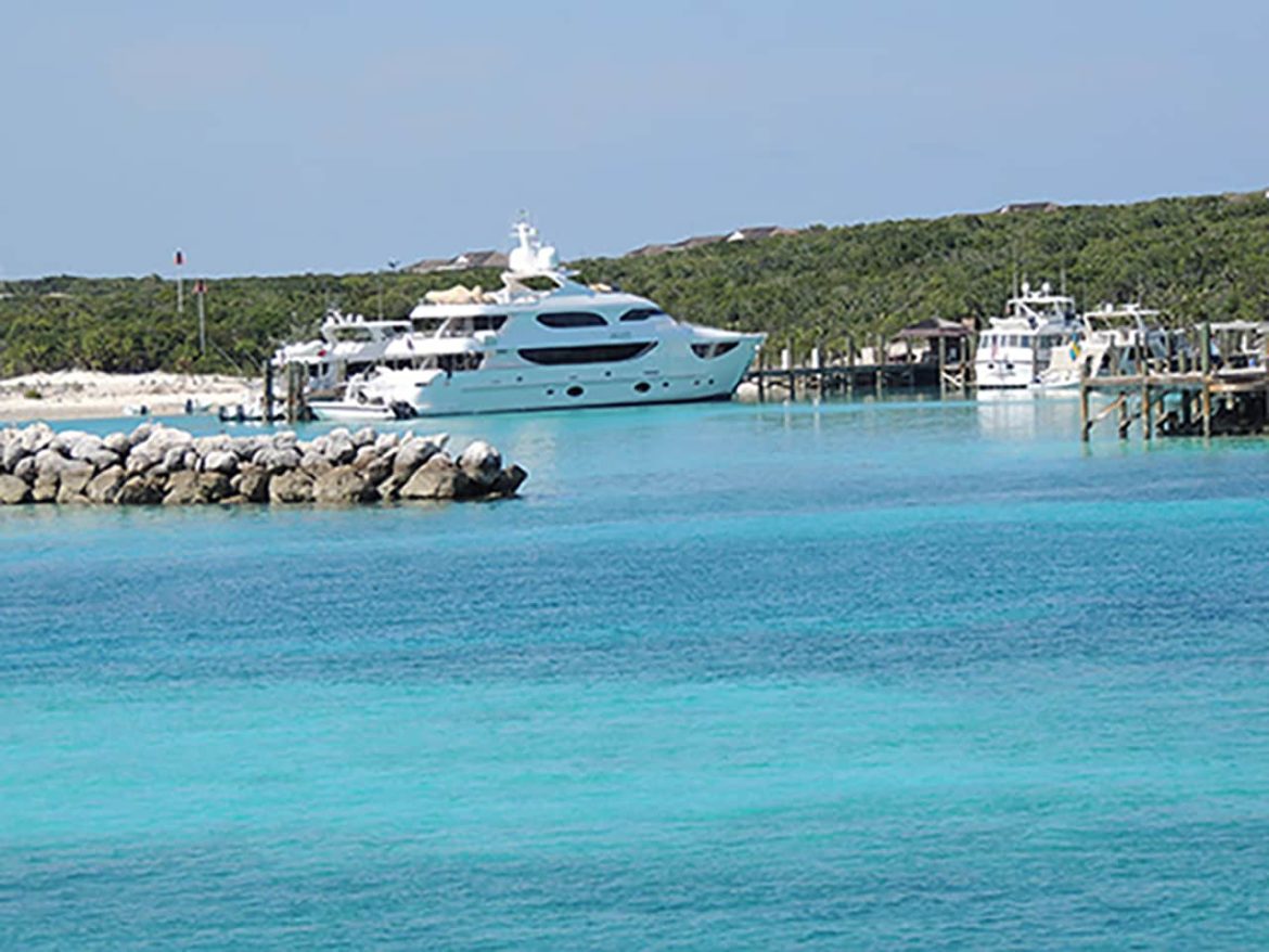 Yacht docked in a harbor in the Bahamas