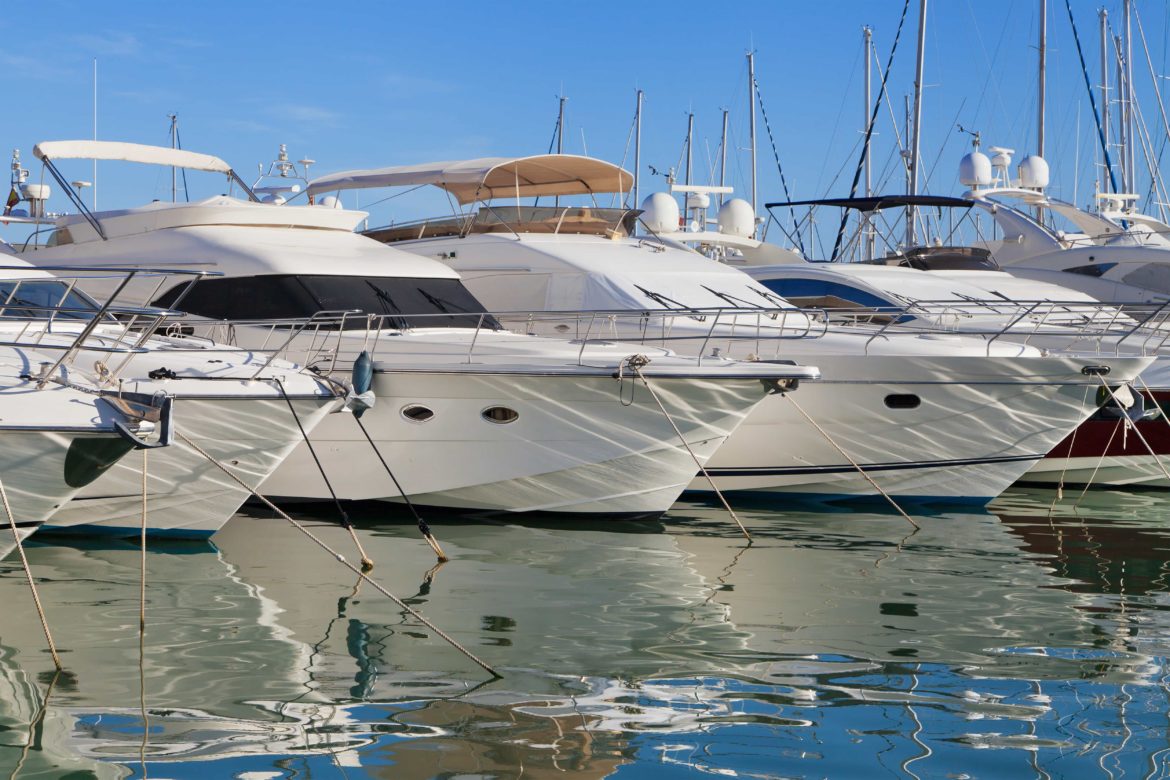 Several yachts docked at the harbor