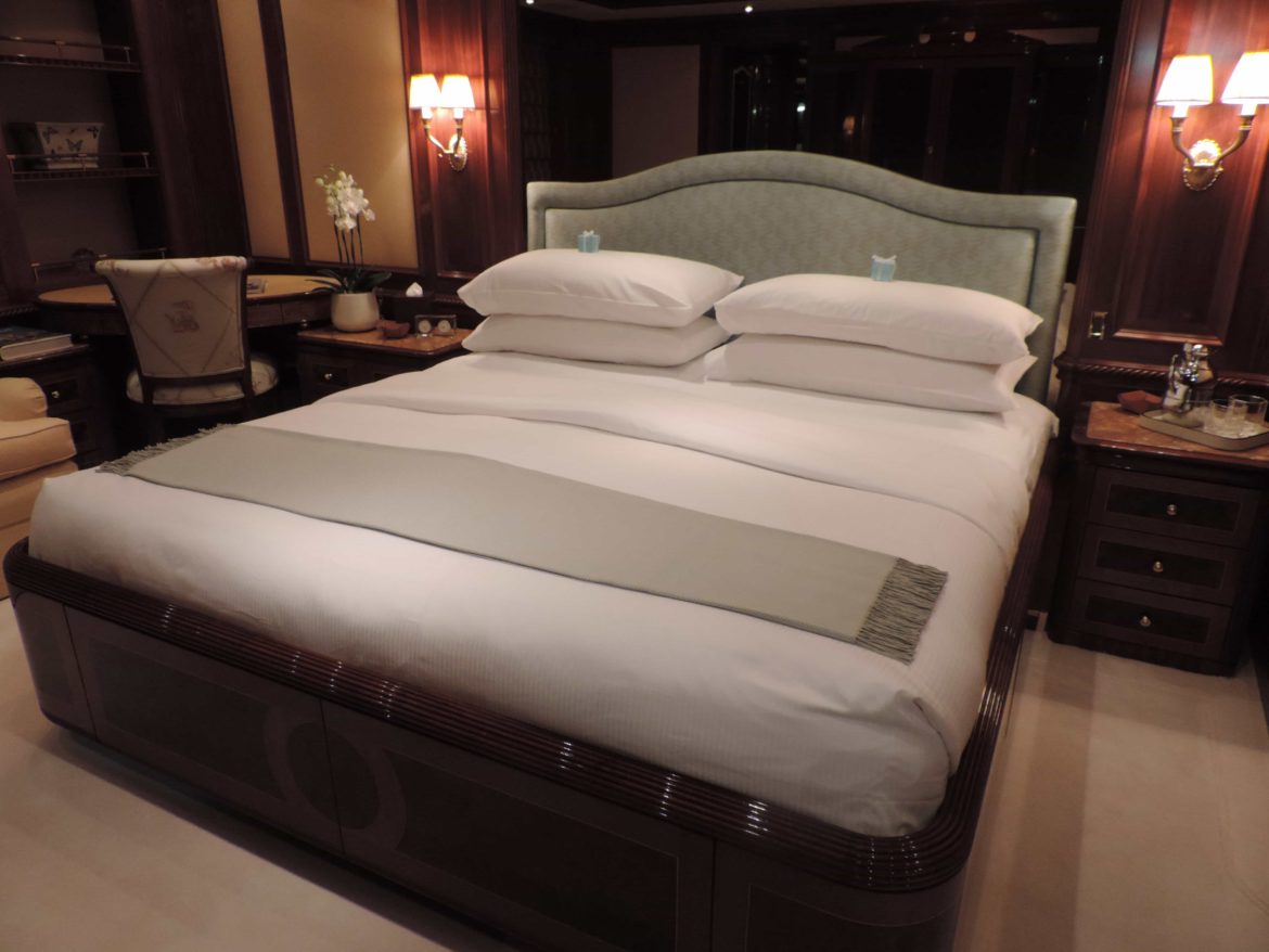 Luxury superyacht master cabin with king bed