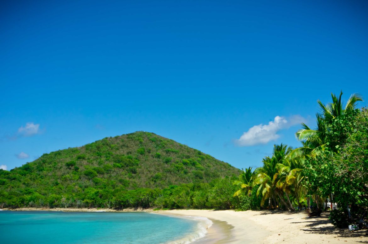 Deserted tropical beach you can explore on your BVI yacht charter