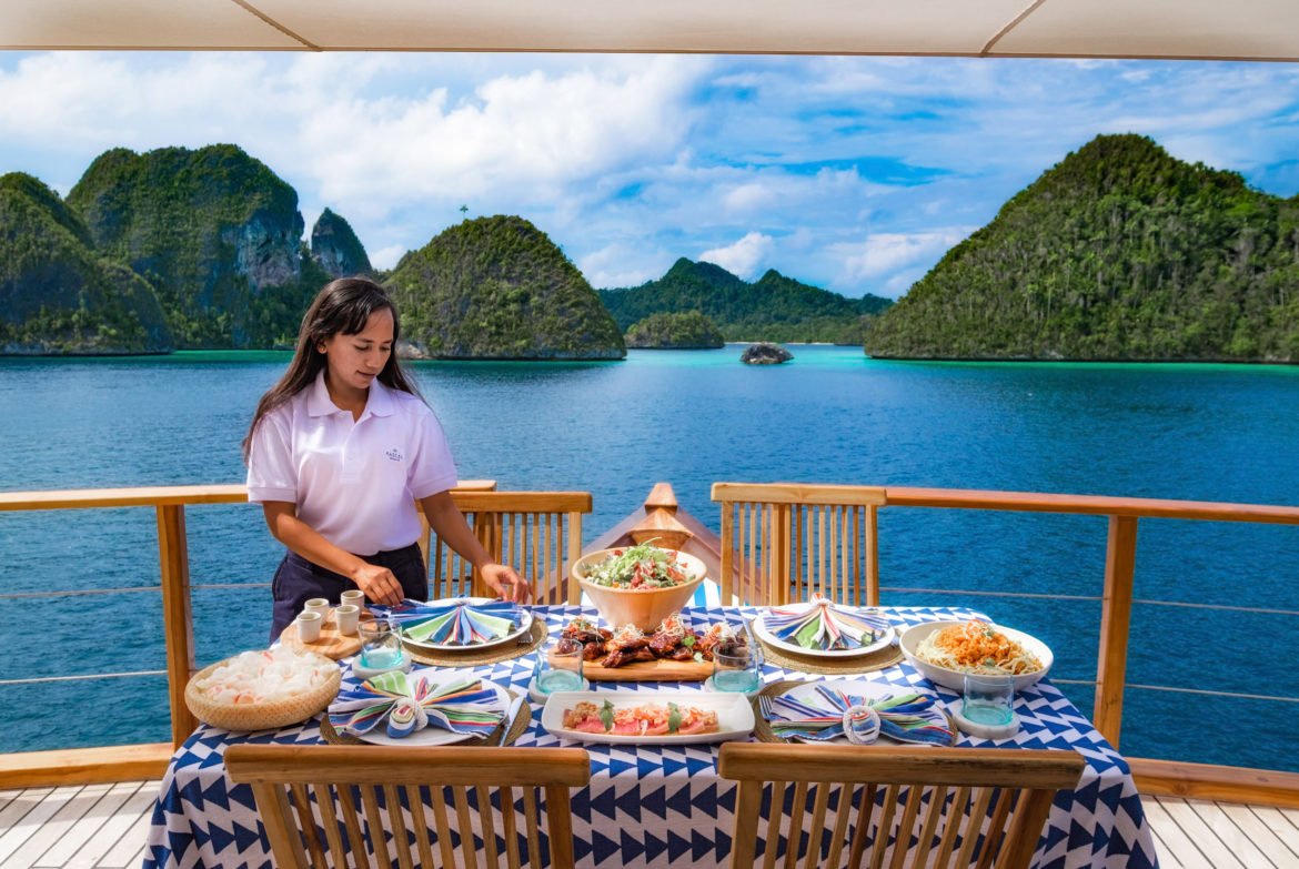 yacht stewardess onboard Rascal prepares lunch