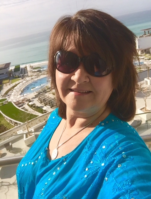 selfie of woman in front of resort