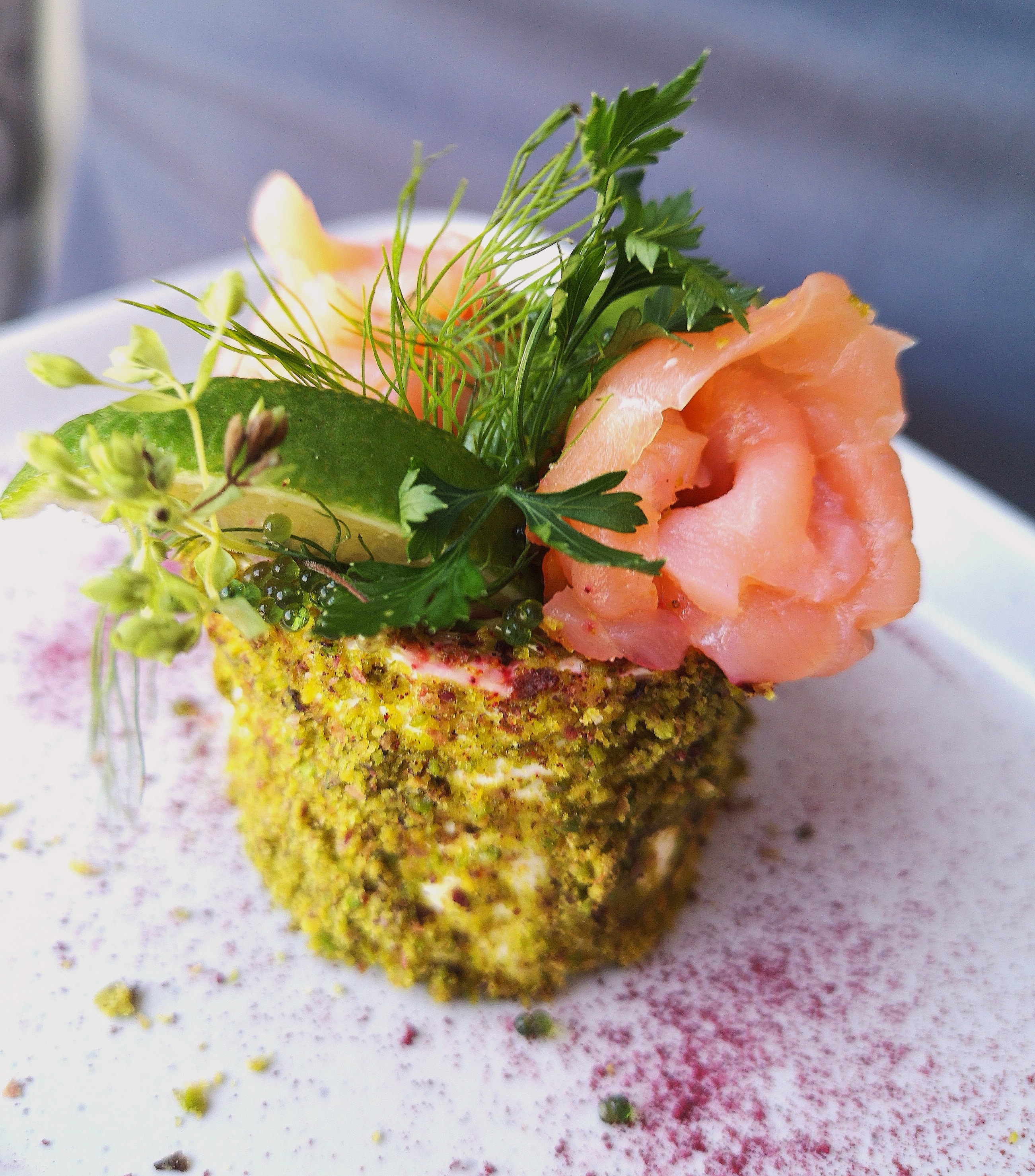plated appetizer with smoked salmon and greens