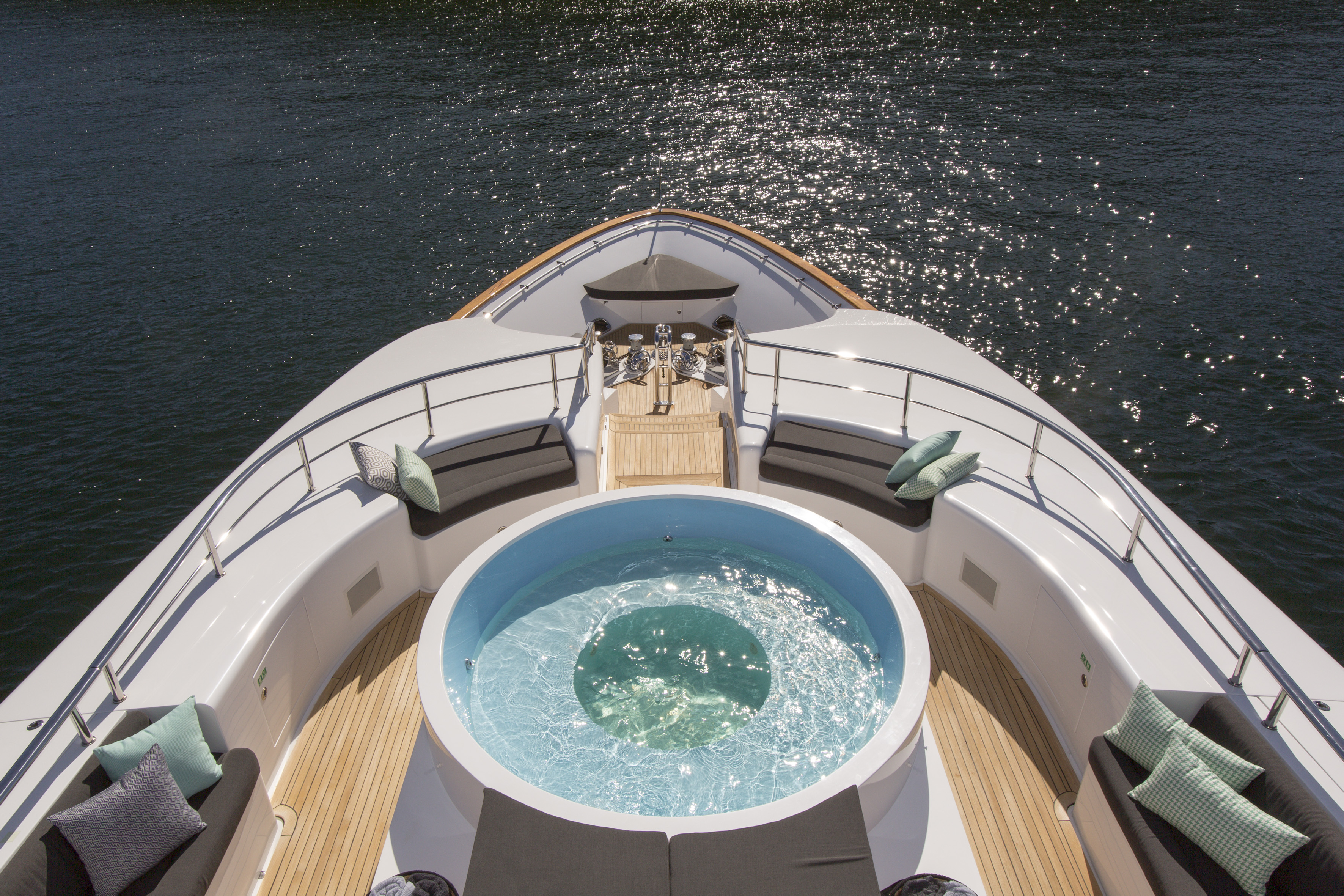 bow of large superyacht with inviting jacuzzi onboard