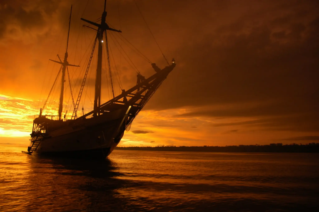 phinisi sailing yacht at sunset