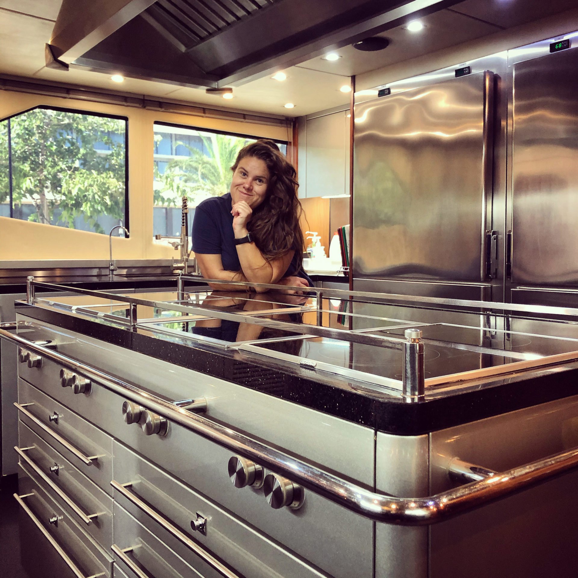 Chef Jeanri smiling in a clean yacht galley