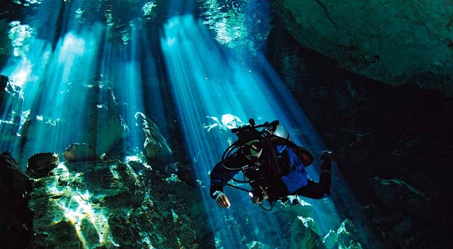 diver explores underwater caves in Mexico