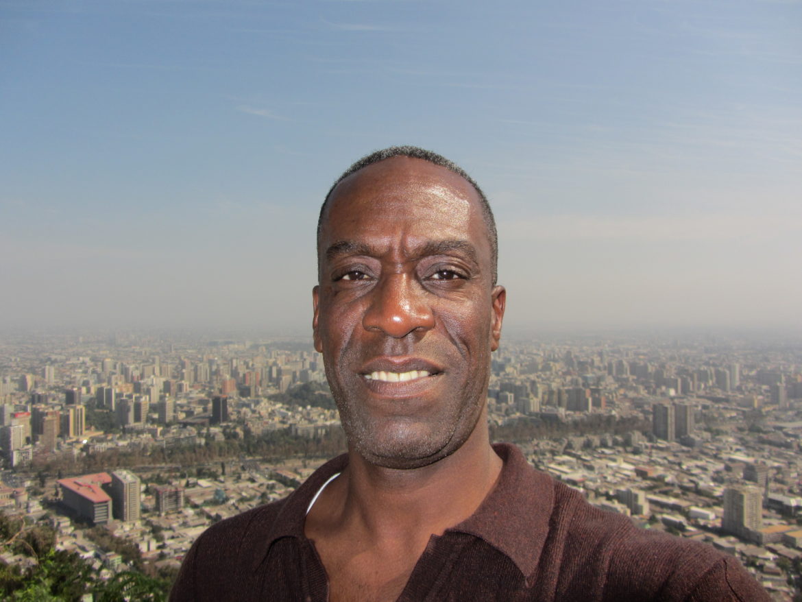 Travel journalist Brian Major takes a selfie with Santiago, Chile in the background
