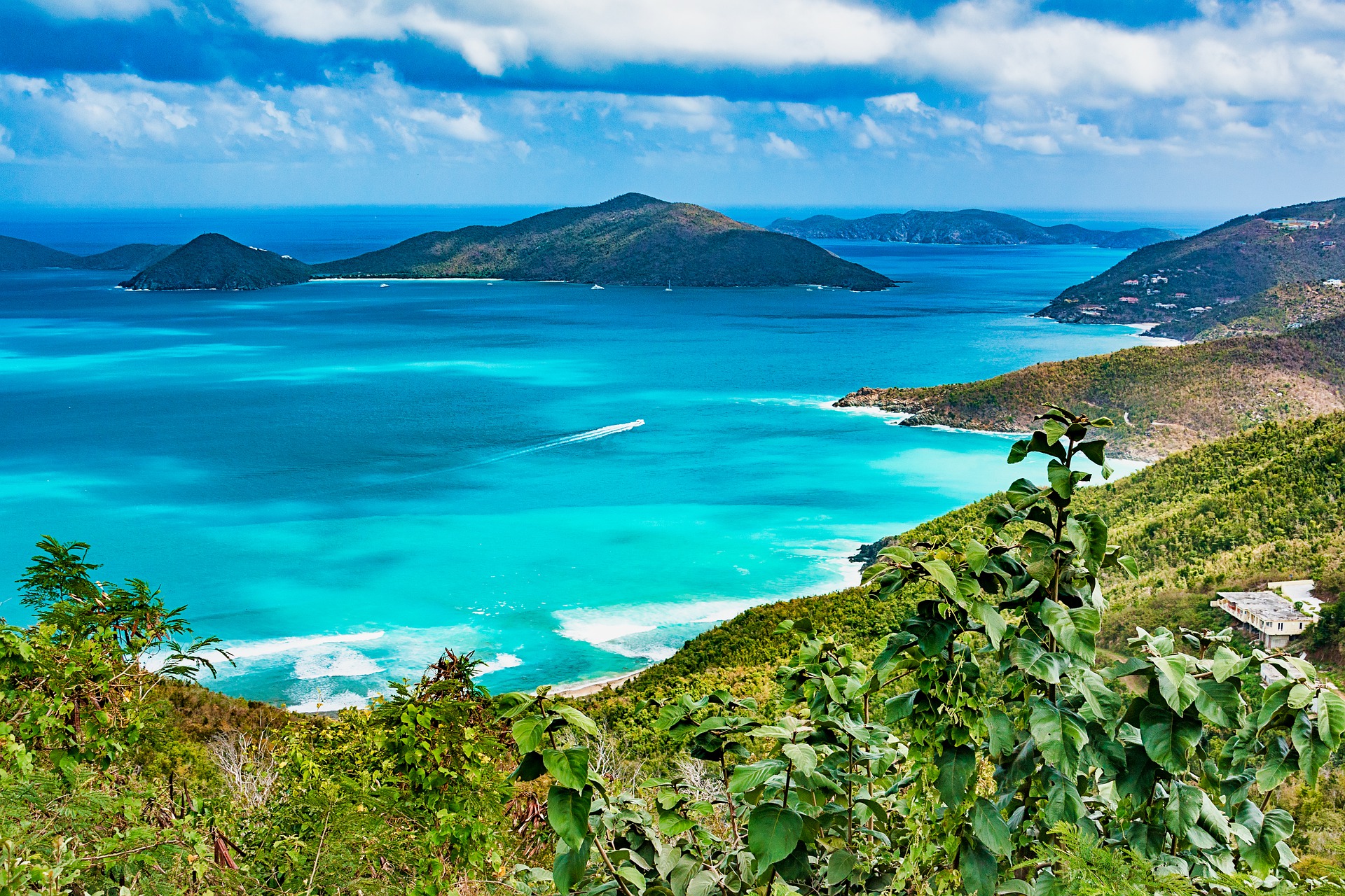 aerial photo of the British Virgin Islands with turquoise waters and mountains