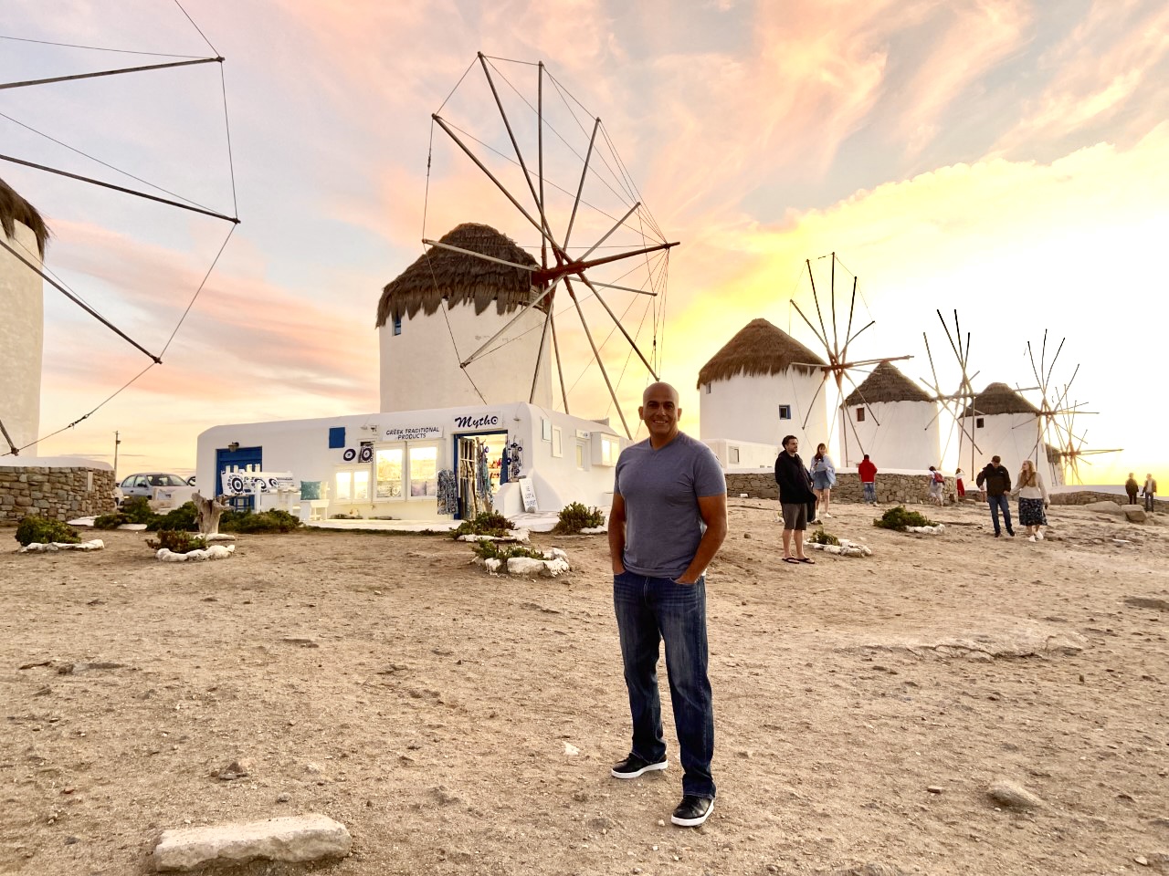 Michael Markarians in Greece with windmills behind him