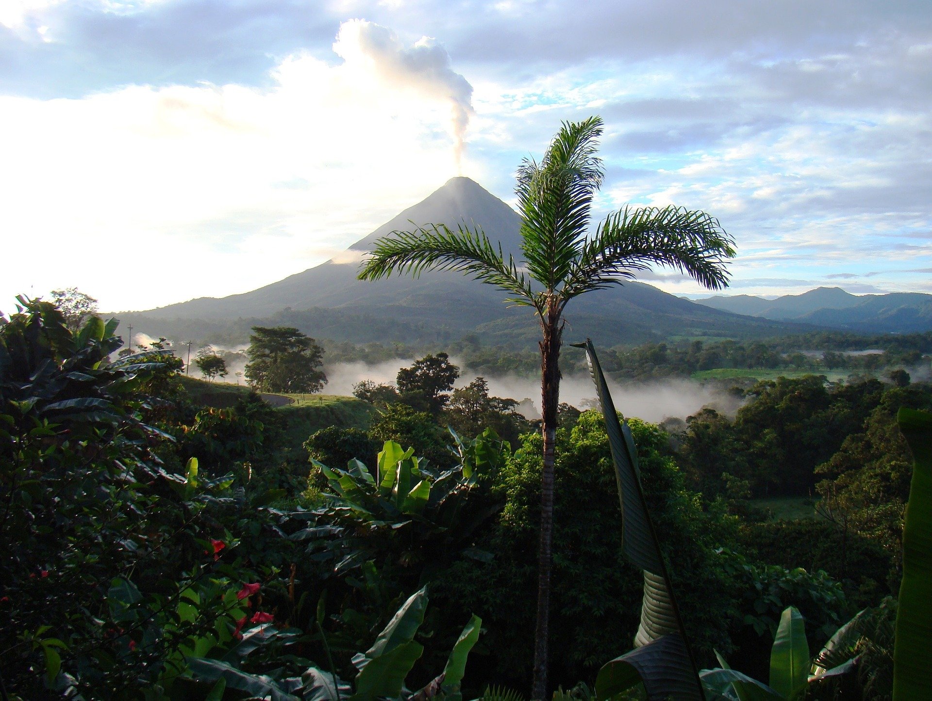 Costa Rica lush vegetation with volcano in background