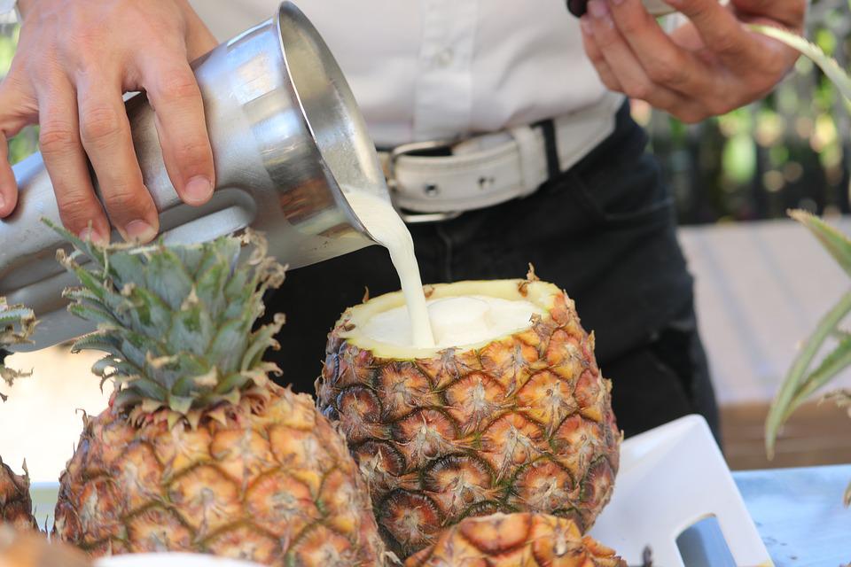 pina colada poured into pineapple